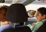 schoolgirl-and-young-woman-interacting-in-car-on-t-2023-11-27-05-26-16-utc-m6Lwa3g08VUj4Pzl